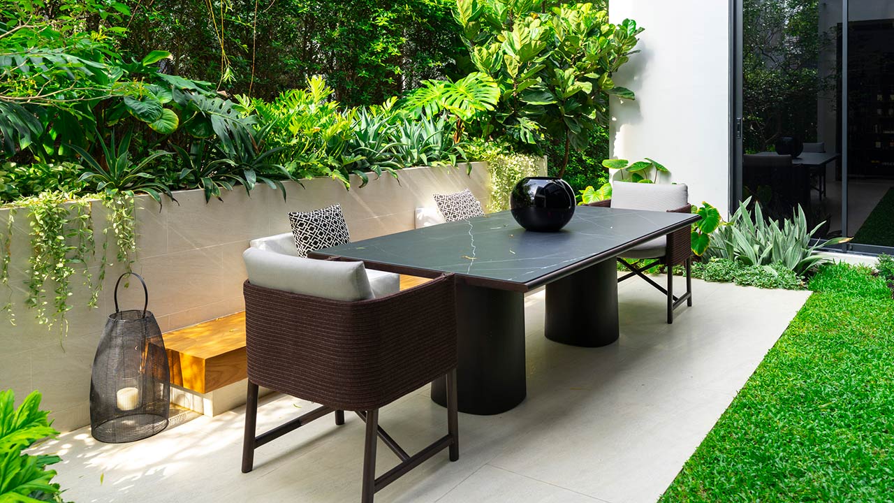 Backyard outdoor patio with modern dining table