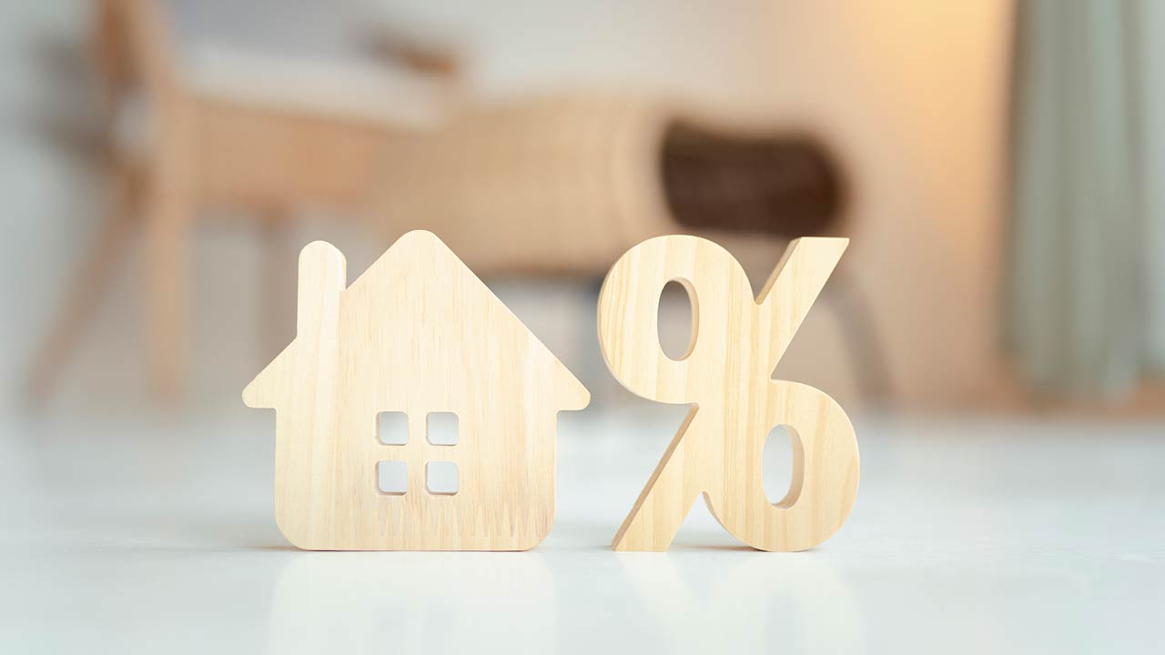 Percentage and house sign symbol icon wooden on wood table